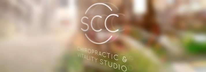 Chiropractic Amherst NH Logo On Blurry Background