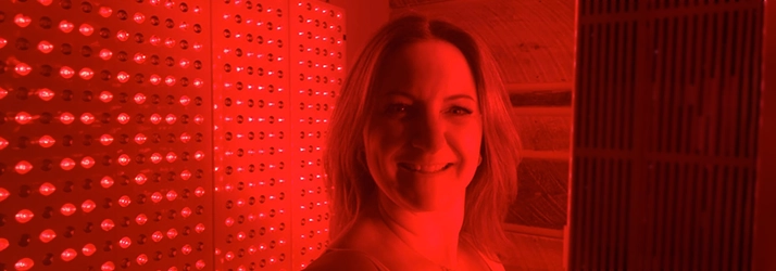 Chiropractor Amherst NH Jenny Bruck In Red Light Therapy Room